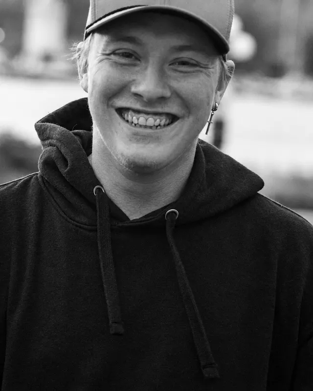 Dameon Spencer, founder of Ajijaak Marketing Co., smiling outdoors